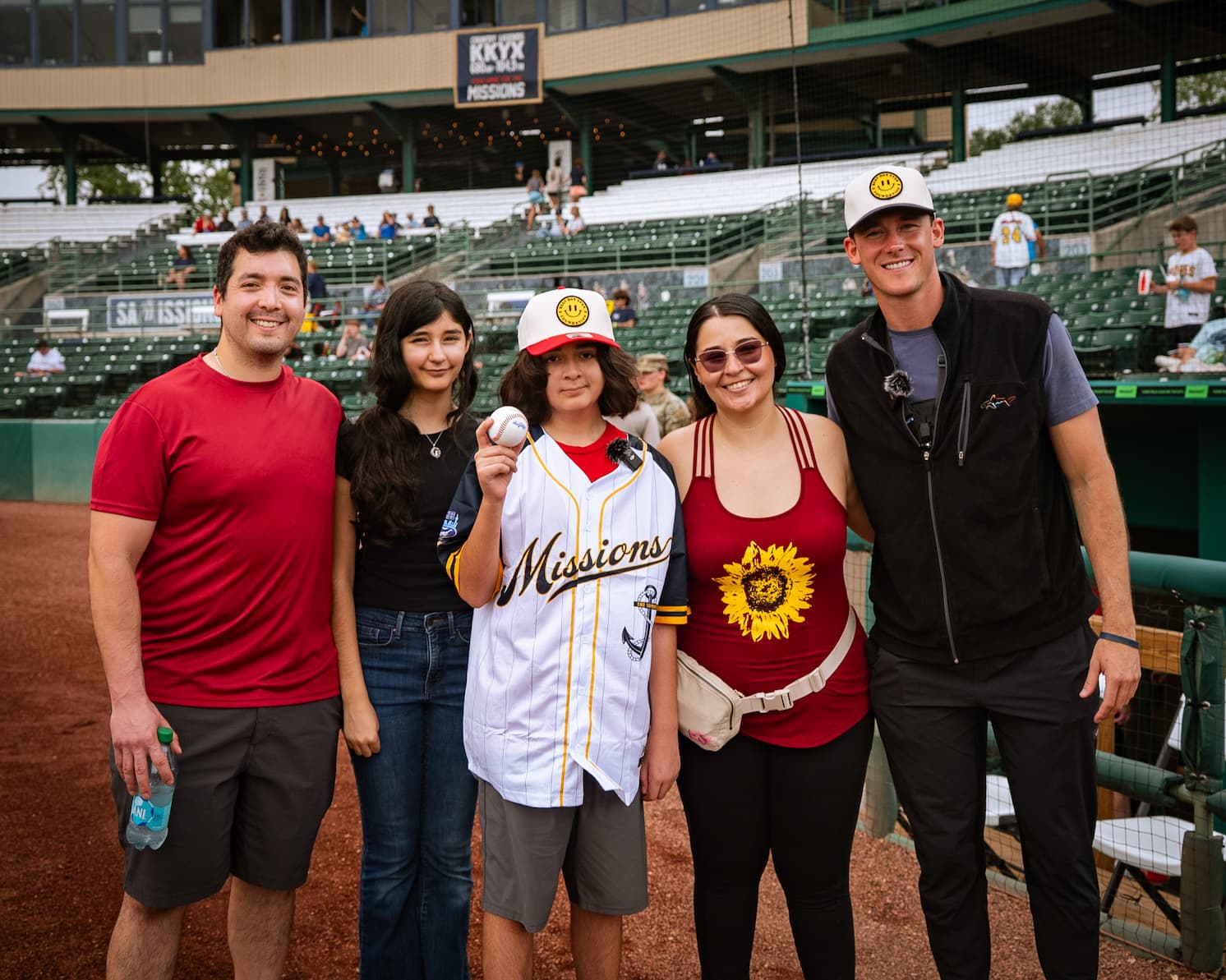 Best Day Ever Foundation team with a family at a San Antonio Missions baseball game